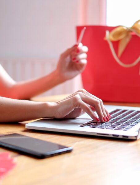 Happy chinese new year. Chinese woman in traditional clothing and shopping online.