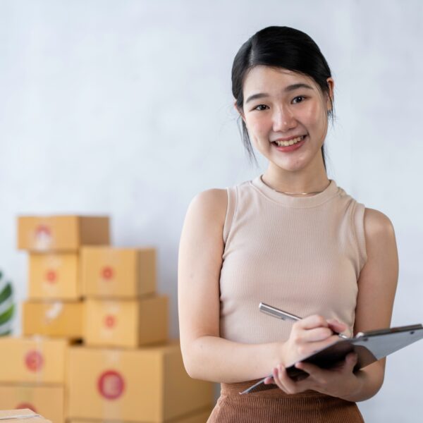 Starting Small business entrepreneur freelance, Portrayoung woman working at home office, BOX, smart